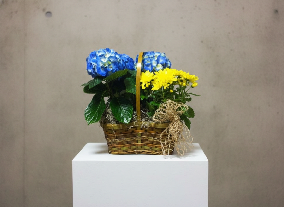 Thanksgiving cornucopia arrangement with mixed flowers, thistle, ferns, and decorative pumpkin on pedestal